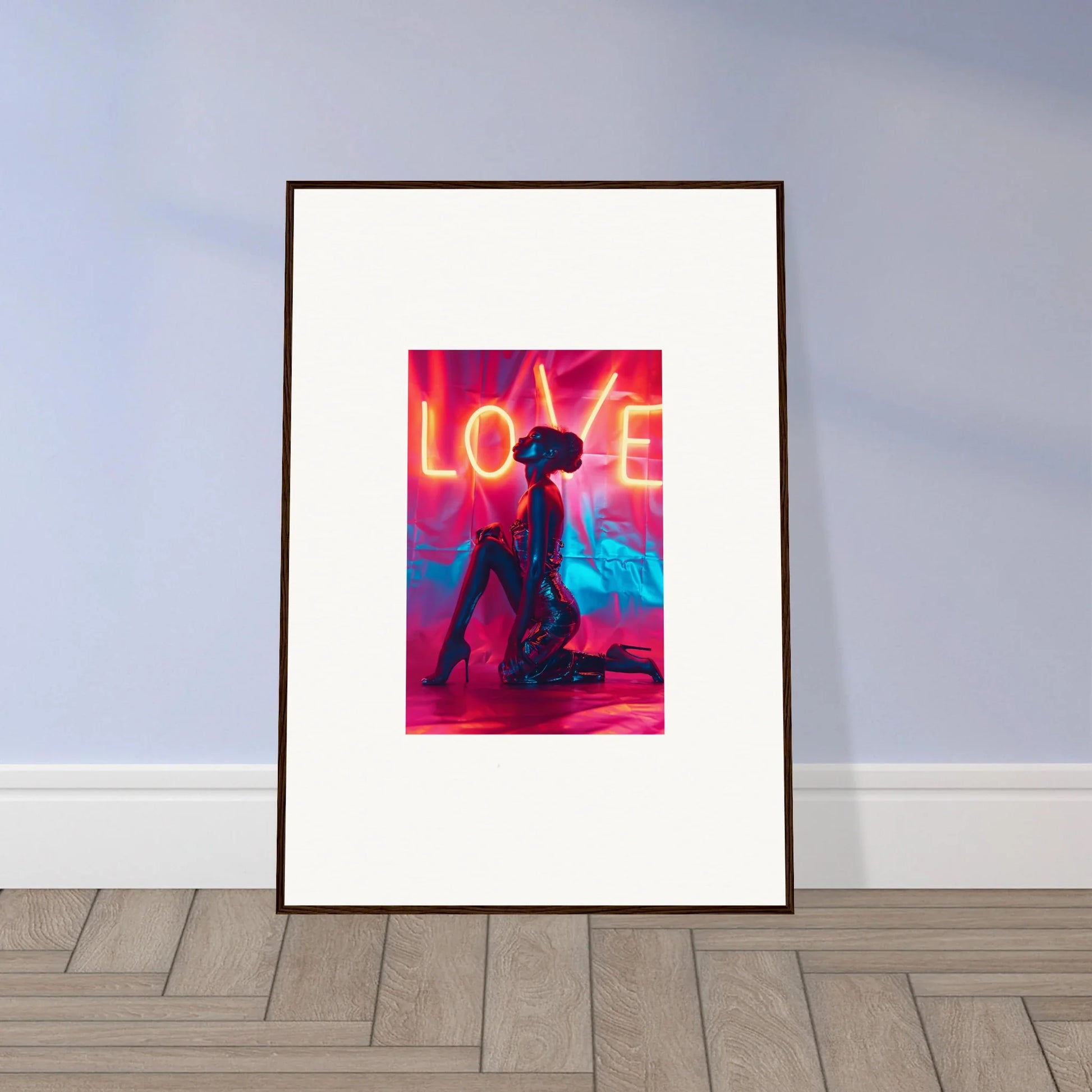 Framed wall art of a silhouetted figure under neon LOVE, perfect for room decoration