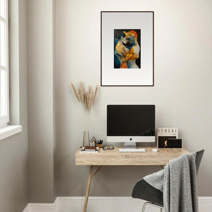 Minimalist home office with wooden desk, computer, and Psyche Harmonies canvas print