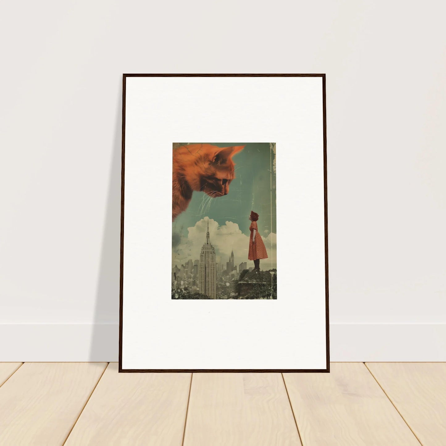 Framed wall art of Giants Gaze, featuring a giant cat head over a city skyline