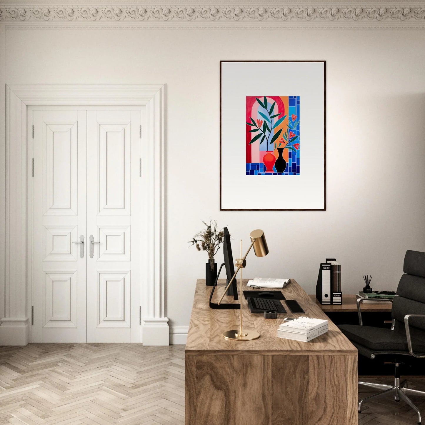 Stylish home office with wooden desk, framed wall art, and ceramic blooms decor