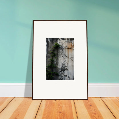 Framed black and white photo of a plant on a wall, perfect for Urban Tango room decoration