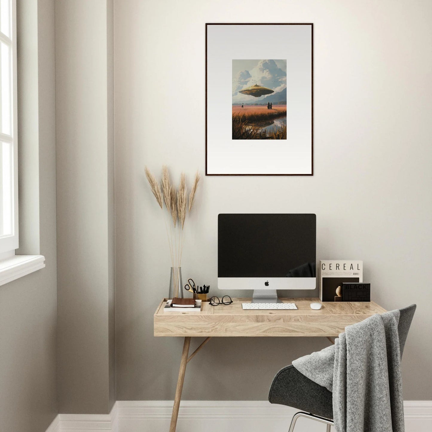 Minimalist wooden desk with a computer and drifting suns canvas print for room decoration