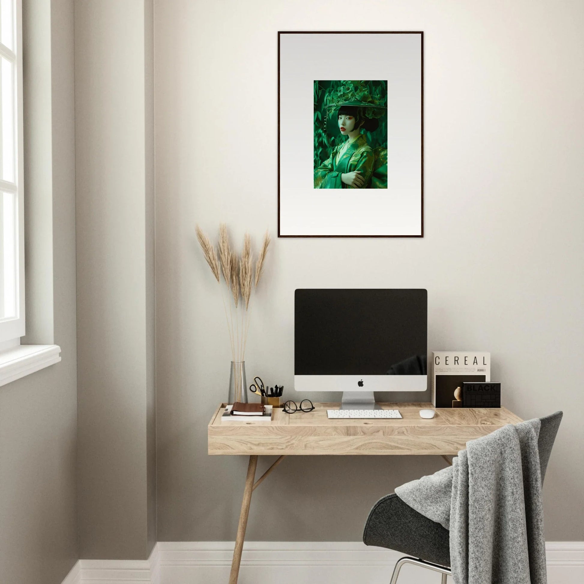 Minimalist home office with a wooden desk, whispering spectacle canvas print, and decor