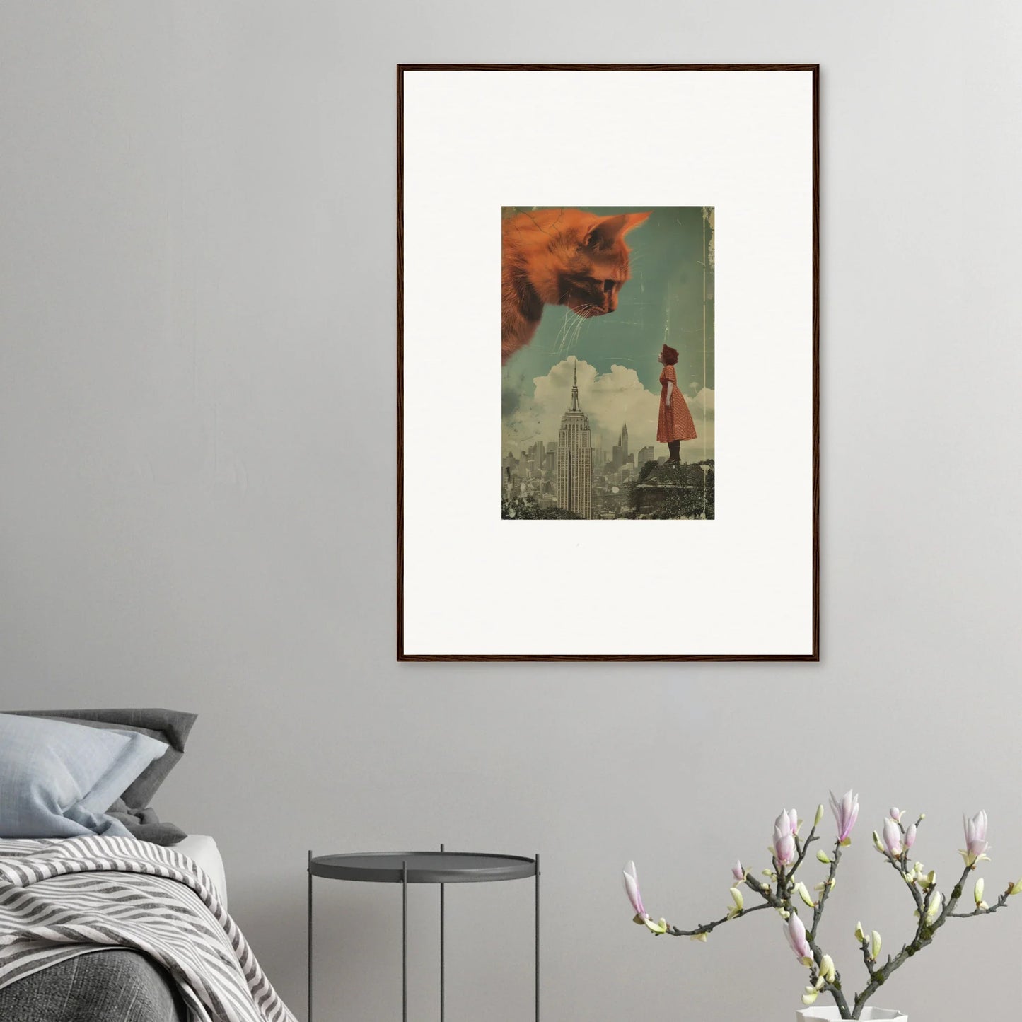 Framed surrealist wall art of a figure in a red dress and a giant cat head, Giants Gaze