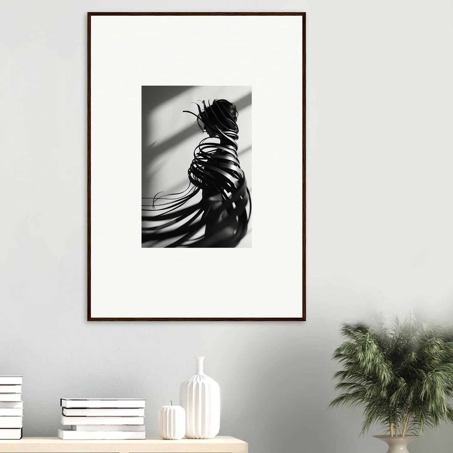 Black and white canvas print of a person with whisper twists and dramatic shadows