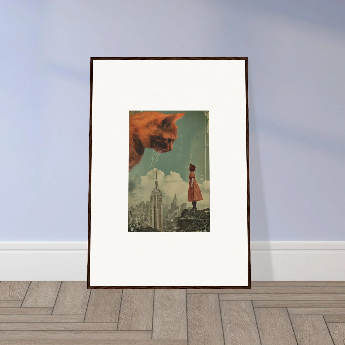 Framed surrealist wall art featuring a figure in red and a giant skull in the sky