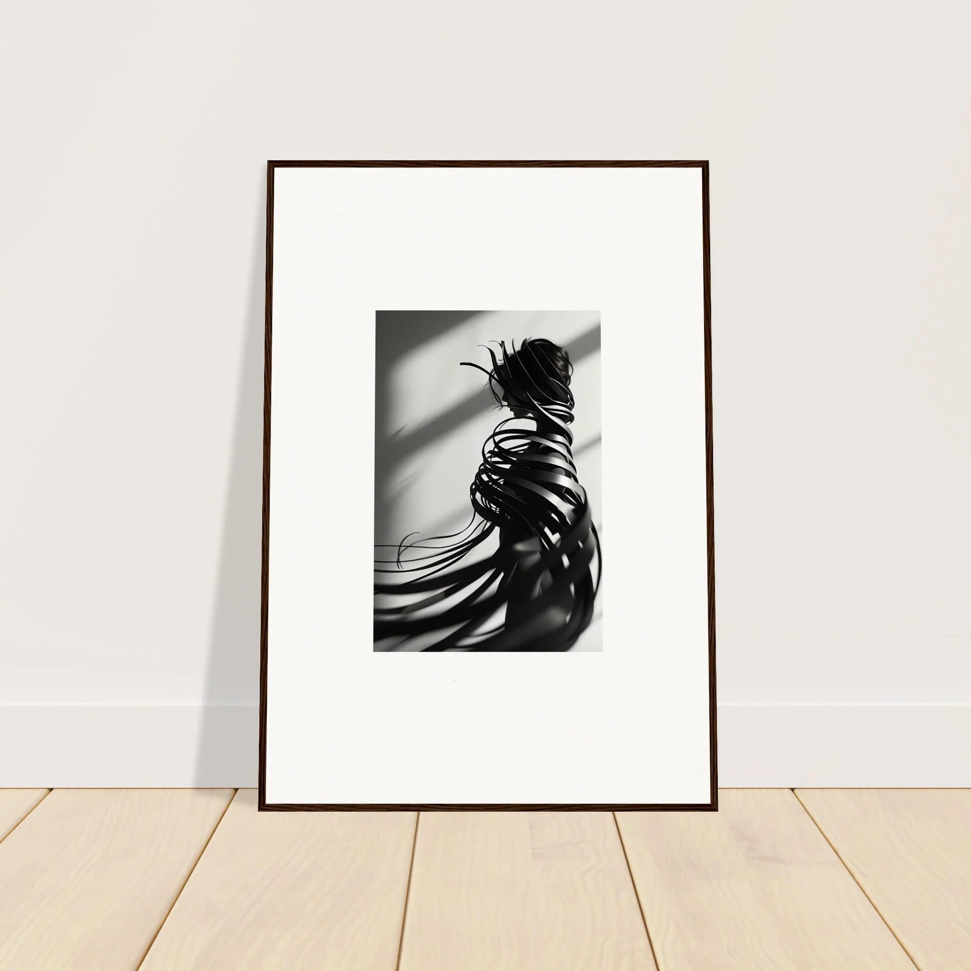 Framed black and white photo of a person’s back, perfect for whisper twists room decoration