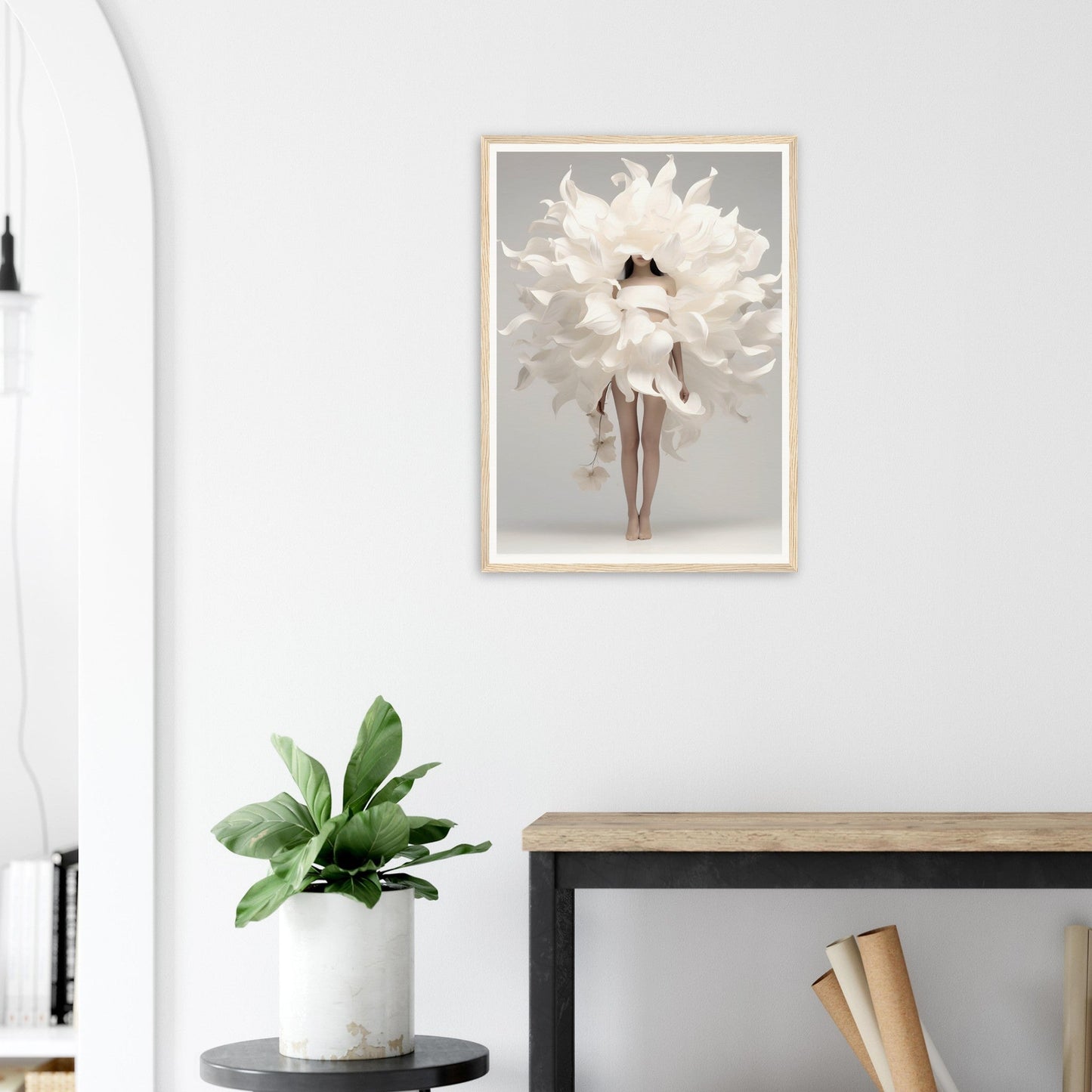 A white flower in a room with a black chair