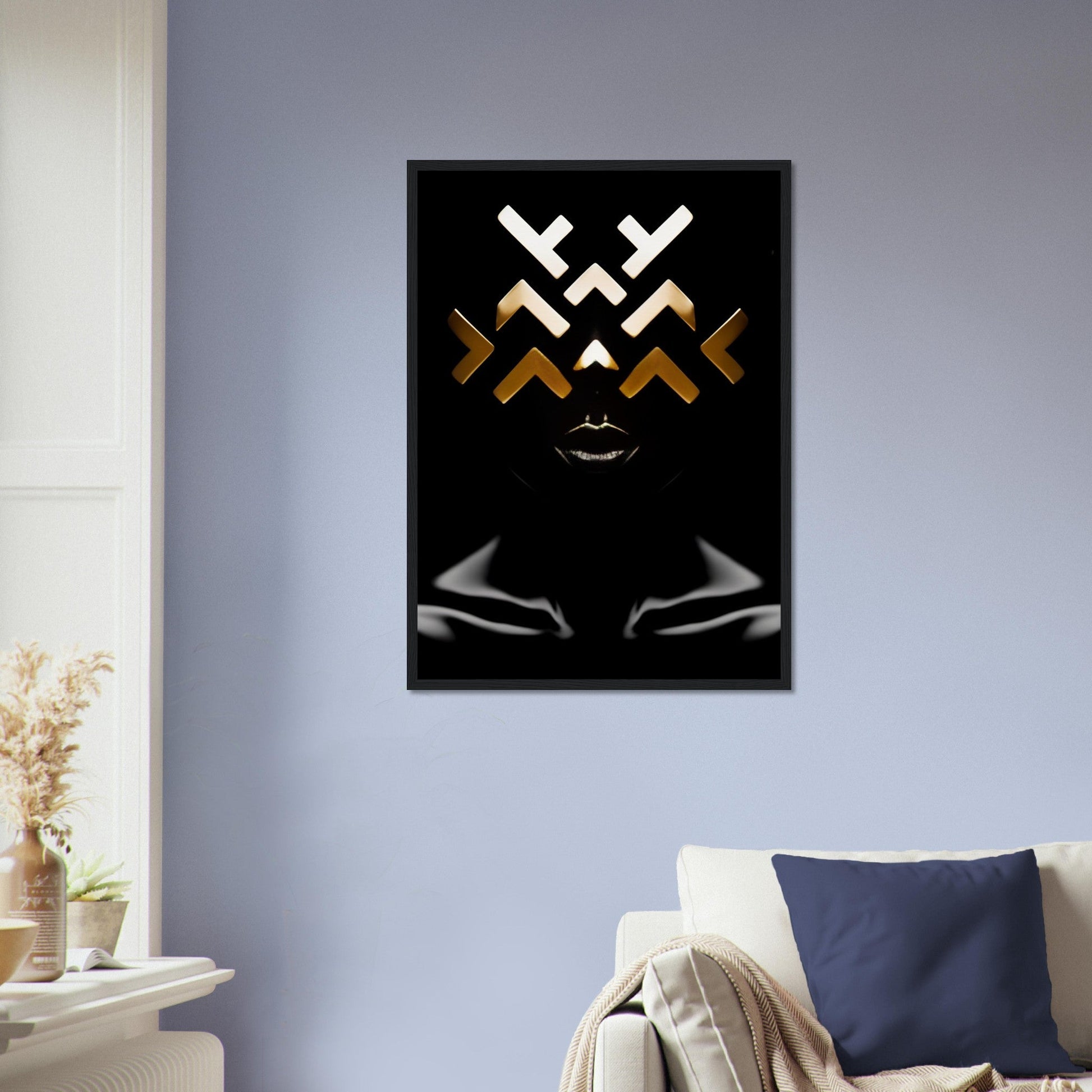 Framed abstract artwork featuring geometric shapes and a stylized face on a black background.