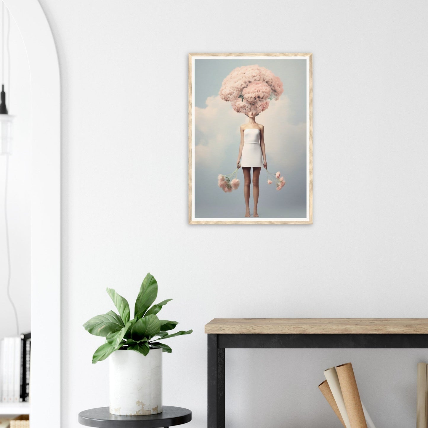 Framed surrealist artwork depicting a figure with a cloud-like pink head wearing a white dress.