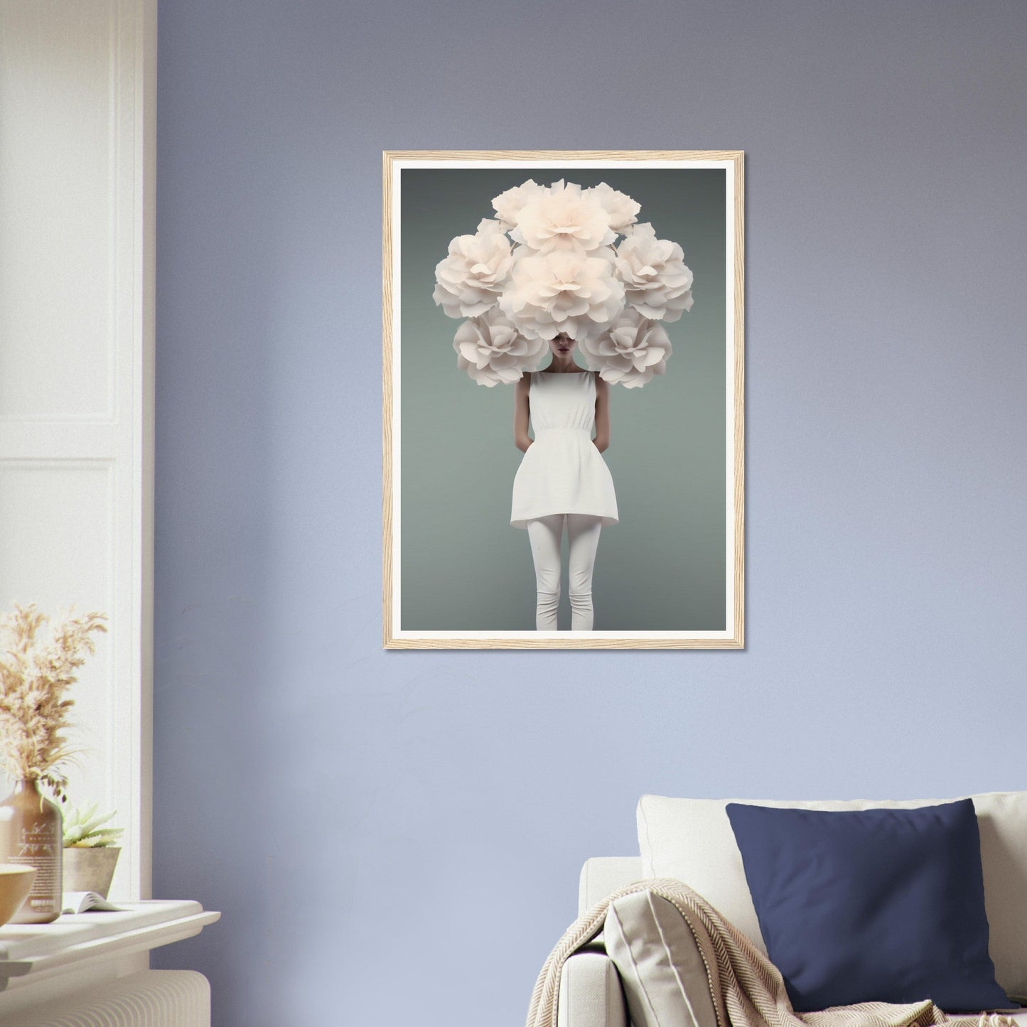 Framed artwork depicting a person with an oversized white floral headdress obscuring their face.