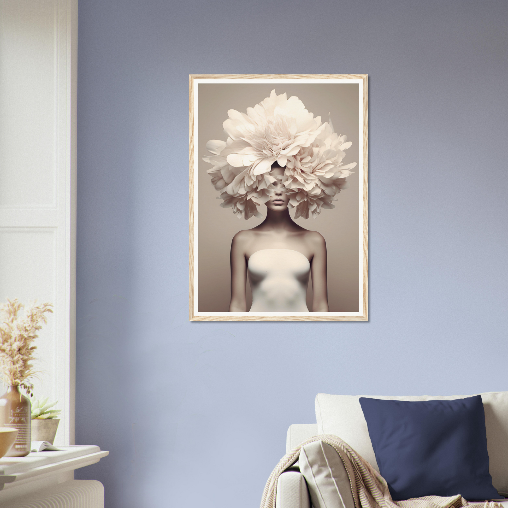 Framed artwork depicting a figure with a large white flower arrangement in place of a head.