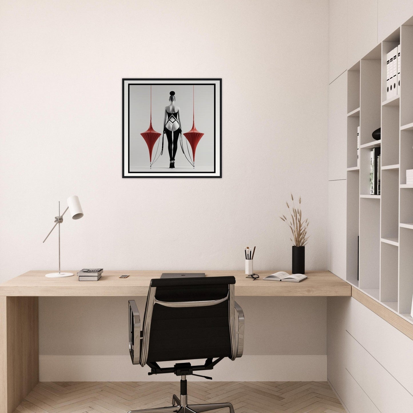 A woman in a black dress with a red umbrella on the wall above her desk