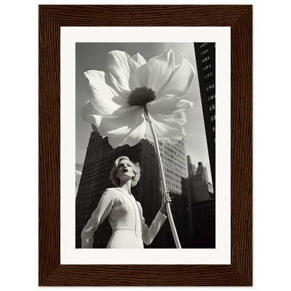 A woman holding a large white flower in front of a tall building