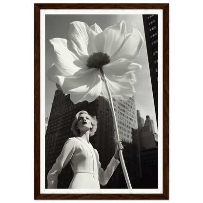 A woman holding a large white flower in front of a tall building