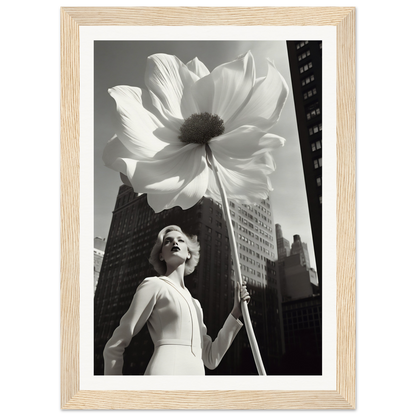 A woman holding a large white flower in front of a tall building